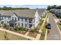 Aerial view of a townhome community, showcasing the subject property at 10193 Meeting House Nw Dr, Huntersville, NC 28078