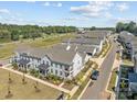 Aerial view of a townhome community with the subject property highlighted at 10193 Meeting House Nw Dr, Huntersville, NC 28078