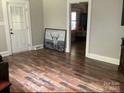 Living room with hardwood floors and access to other rooms at 305 N Milford Dr, Salisbury, NC 28144