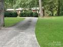 Long driveway leading to a brick ranch house at 305 N Milford Dr, Salisbury, NC 28144