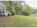 Mobile home with a large grassy backyard at 519 S Mulberry St, Cherryville, NC 28021