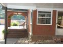 Covered porch with brick flooring and seating area at 2124 W Main St # C, Albemarle, NC 28001