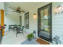 Inviting front porch with seating and stylish door at 540 Kenway Loop, Mooresville, NC 28117