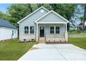 Newly built gray house with a welcoming front porch at 602 Meadow Ave, Spencer, NC 28144