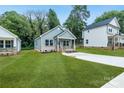 Gray house with brick accents and a large yard at 602 Meadow Ave, Spencer, NC 28144