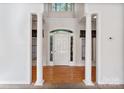 Grand entryway with hardwood floors and columns at 108 Cottonwood Dr, Mount Holly, NC 28120