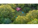 Aerial view of property with home and wooded area at 9226 Maggie Robinson Rd # 143, Waxhaw, NC 28173