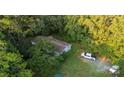 Aerial view of property with home and wooded area at 9226 Maggie Robinson Rd # 143, Waxhaw, NC 28173