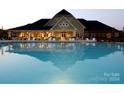 Resort-style pool with a large clubhouse and comfortable seating at 12813 Mayes Rd, Huntersville, NC 28078