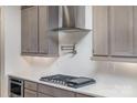 Stylish kitchen with stainless steel range hood and hexagon backsplash at 1336 Sage Pine Cir # 21, Clover, SC 29710