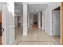 Bright and spacious entryway with tile floors and views to the living room and kitchen at 4532 Lanstone Sw Ct, Concord, NC 28027