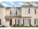 Two-story townhome with brown accents and a small front yard at 8333 Washoe Pine Ln, Charlotte, NC 28215