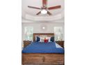 Spacious main bedroom with a large bed, nightstands and ceiling fan at 145 Beacon Dr # F, Mooresville, NC 28117