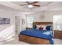Spacious main bedroom with a large bed, nightstands and ceiling fan at 145 Beacon Dr # F, Mooresville, NC 28117