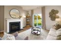 Living room with fireplace, sliding door to patio, and a neutral color scheme at 3694 Charles Nw St, Conover, NC 28613