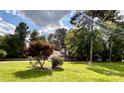 Ranch home with a large yard and mature trees at 142 Scotland Dr, Mooresville, NC 28115
