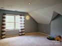 Spacious bedroom with a large window and neutral walls at 4905 Benthaven Ln # 321, Charlotte, NC 28269