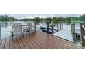 Private dock with seating area overlooking the lake at 165 Woodstream Cir, Mooresville, NC 28117