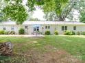 Large backyard with patio, seating area, and plenty of grass space at 8909 Highway 218 Hwy, Marshville, NC 28103