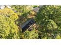 Elevated view of home nestled amongst lush trees at 201/215 Smithfield Dr, Charlotte, NC 28270