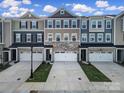 Three-unit townhouse exterior with gray and beige siding at 432 Burr St # 73, Indian Trail, NC 28079