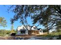 Modern farmhouse exterior with pond view at 104 Arbor Dr, Waxhaw, NC 28173