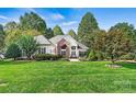 House exterior, showcasing a well-maintained lawn and landscaping at 1375 Valhalla Dr, Denver, NC 28037