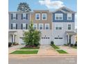 Three-unit townhome building with attached garages at 1134 Keydet Dr, Charlotte, NC 28216