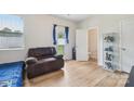 Bright bedroom with a comfy chair and access to a private bathroom at 1134 Keydet Dr, Charlotte, NC 28216