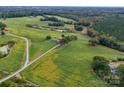 Aerial view of property showcasing home and surrounding fields at 8510 Olive Branch Rd, Marshville, NC 28103
