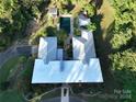 Bird's eye view of a home with a pool and detached garage at 501 Journey Sw St, Concord, NC 28025