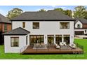 Large deck with seating and dining areas at 5428 Carmel Rd, Charlotte, NC 28226