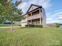 Two-story home with a two-car garage and manicured lawn at 131 Renville Pl, Mooresville, NC 28115