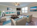 Bright living room with fireplace and hardwood floors at 131 Renville Pl, Mooresville, NC 28115