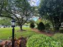 Landscaped front yard with mature trees and lush greenery at 1011 Ratchford Rd, York, SC 29745