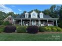 Brick home with front porch and manicured landscaping at 1011 Ratchford Rd, York, SC 29745
