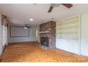 Living room with brick fireplace and hardwood floors at 1925 Montclair Ave, Gastonia, NC 28054