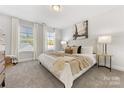Spacious bedroom with plush carpeting and large windows at 504 Kingsway Cir, Charlotte, NC 28214