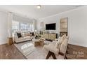 Bright and airy living room with hardwood floors and neutral decor at 504 Kingsway Cir, Charlotte, NC 28214