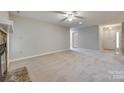 Spacious living room with neutral carpeting and fireplace at 151 Cedar Hollow St, Fort Mill, SC 29715