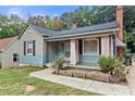 Quaint house exterior with light taupe siding, blue accents, and a welcoming front porch at 515 Suttle St, Shelby, NC 28150