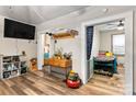 Bright living room featuring hardwood floors, a TV, and an open doorway to a bedroom at 515 Suttle St, Shelby, NC 28150