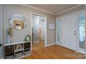Bright and spacious entryway with hardwood floors and a view of the living room at 272 Millingport Ln, New London, NC 28127