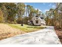 Two story light gray brick home with driveway at 1025 Readsboro Dr # 11, Mt Ulla, NC 28125