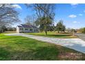 Ranch home with a long driveway, showcasing its curb appeal and landscaping at 1816 Sulphur Springs Rd, Shelby, NC 28152