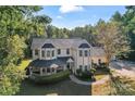 Two story house with wrap around porch, large yard at 2720 Lentz Rd, China Grove, NC 28023