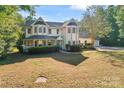 Two story house with wrap around porch, large yard at 2720 Lentz Rd, China Grove, NC 28023