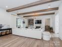 Spacious living room with hardwood floors, exposed beams, and ample natural light at 1013 Maxwell Ct # 4, Marvin, NC 28173