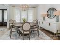 Modern dining room with large round table and stylish sideboard at 1013 Maxwell Ct # 4, Marvin, NC 28173