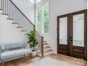 Bright and spacious entryway with modern staircase and wood floors at 1013 Maxwell Ct # 4, Marvin, NC 28173